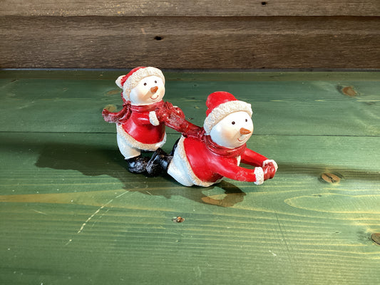 Red Coat Playing Snowmen